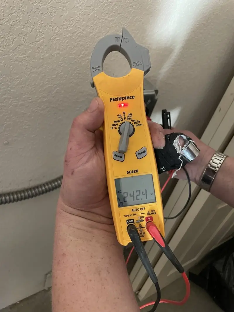 Voltage testing with clamp meter during Recessed Lighting Installation in West Liberty